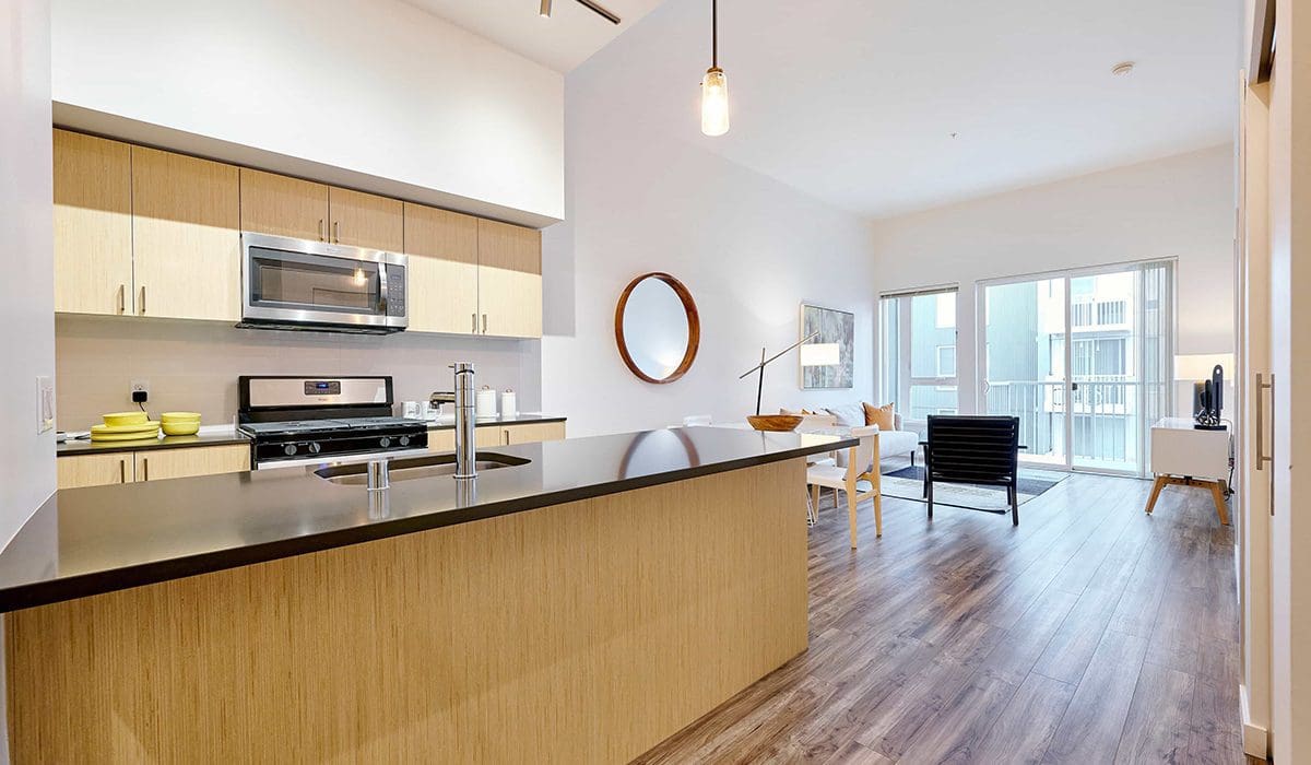 Downtown Bellevue Apartments - Arras - Modern, Open Kitchen with Wood-Style Flooring, Large Island, and Stainless Appliances